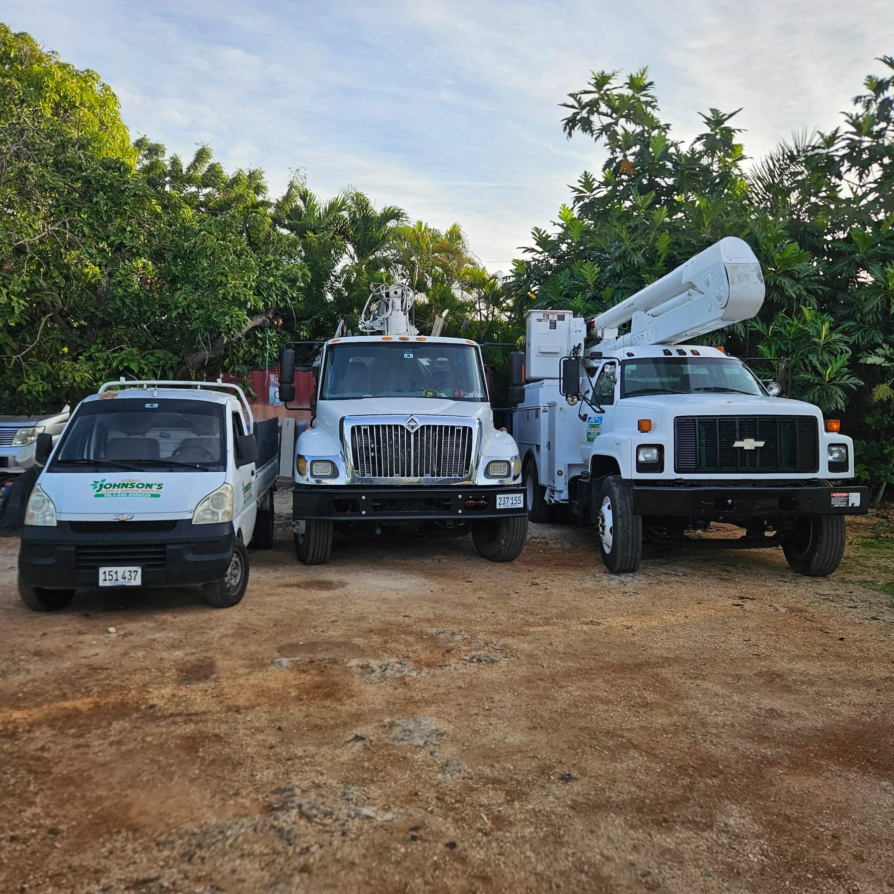 Johnson’s Lawn & Garden service vehicles ready for work in Grand Cayman