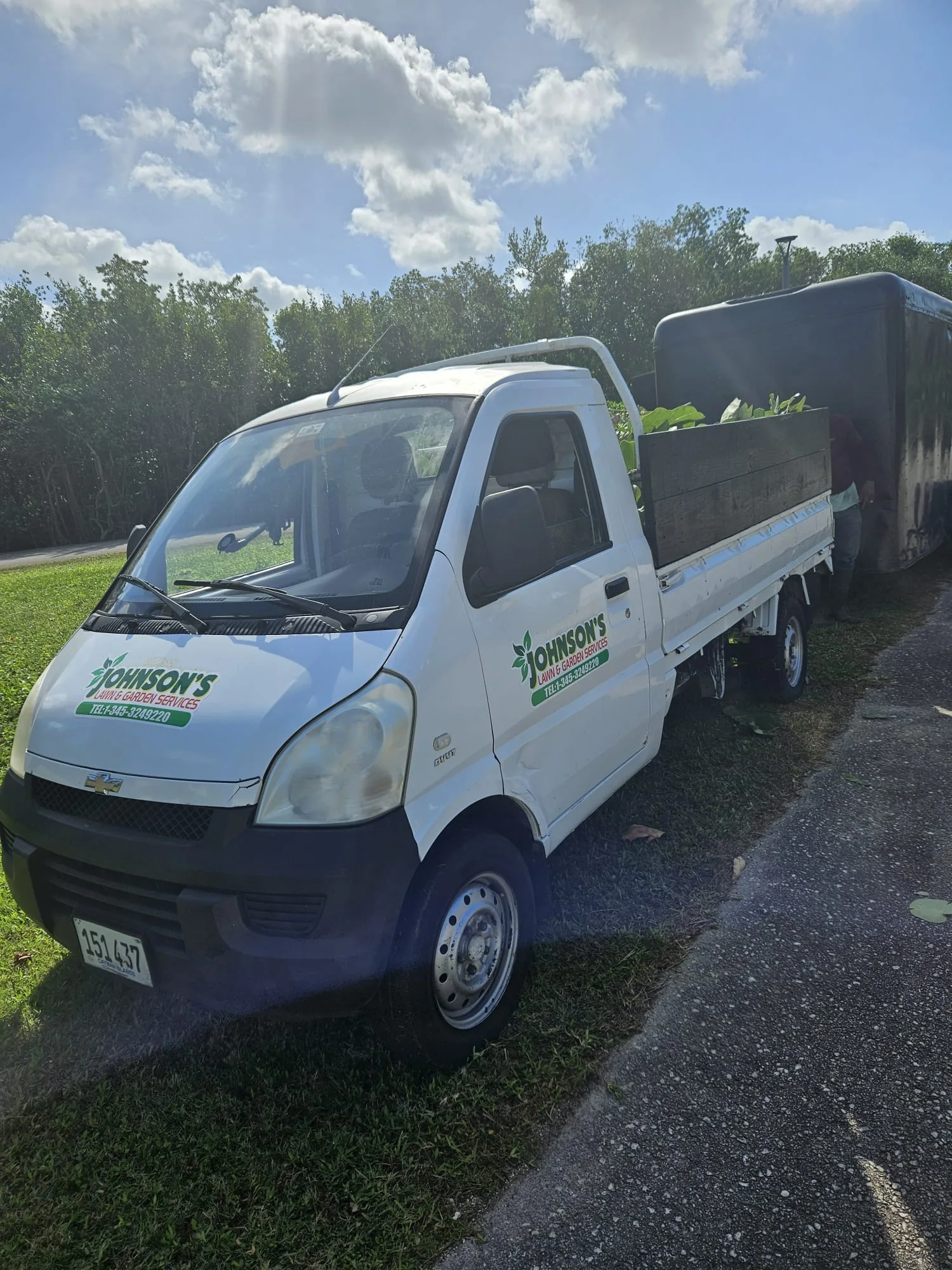 Johnson’s white service truck loaded for outdoor work